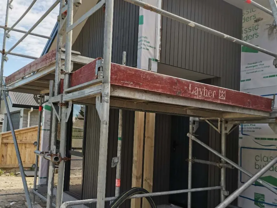 Exterior wall re-clad underway with scaffolding in place
