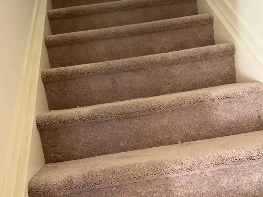 New carpet laid over a full flight of stairs