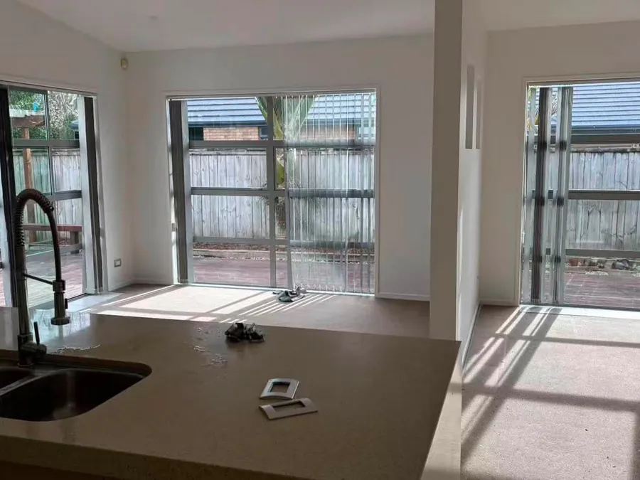 Kitchen bench and cabinetry installed in front of new windows