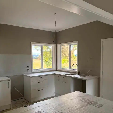 Kitchen fit-out with new cabinetry and corner windows