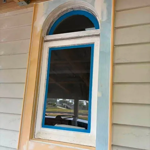 New window installed in painted weatherboard cladding